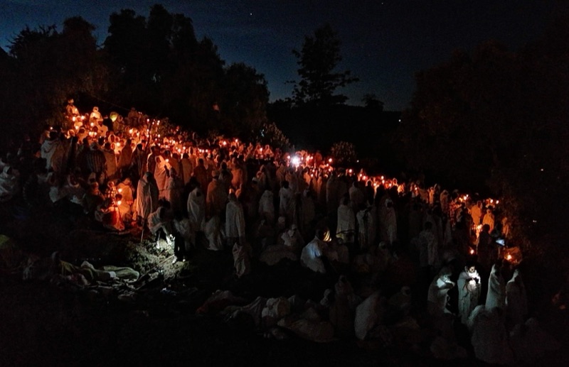 Ethiopian Orthodox faithful holding candles at the Christmas vigil in Lalibela